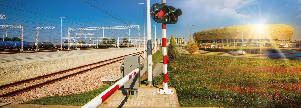 Railway tracks, traffic lights and stadium