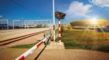 Railway tracks, traffic lights and stadium